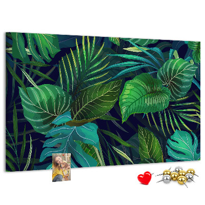 Tablero de corcho decorativo con diseño de hojas tropicales sobre fondo oscuro