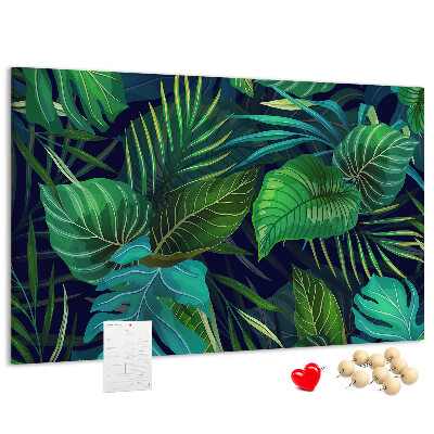Tablero de corcho decorativo con diseño de hojas tropicales sobre fondo oscuro