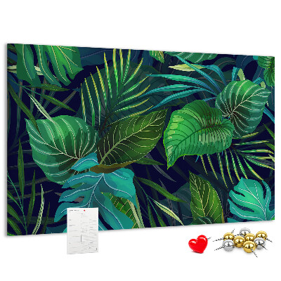 Tablero de corcho decorativo con diseño de hojas tropicales sobre fondo oscuro