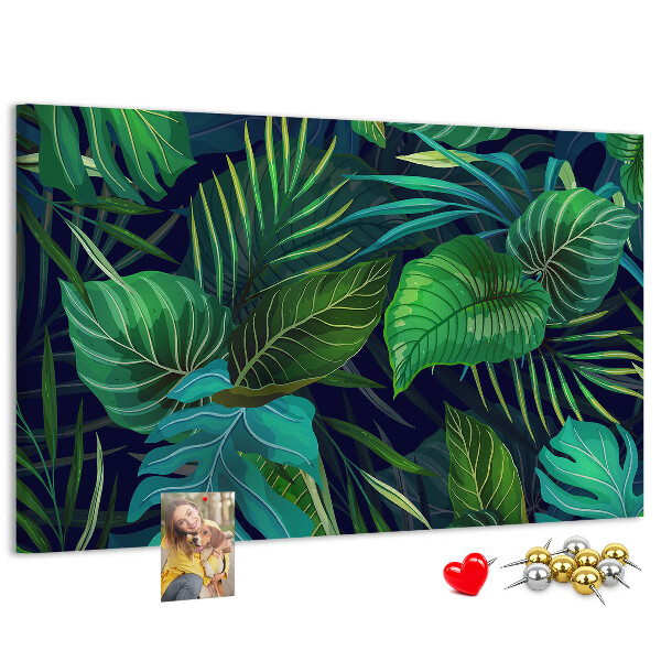 Tablero de corcho decorativo con diseño de hojas tropicales sobre fondo oscuro