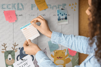 Tablero de corcho decorado planificador semanal con diseño de animales coloridos