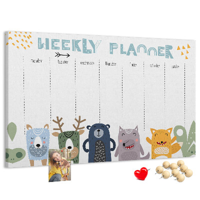 Tablero de corcho decorado planificador semanal con diseño de animales coloridos