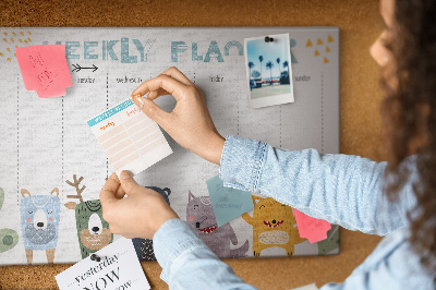 Tablero de corcho decorado planificador semanal con diseño de animales coloridos
