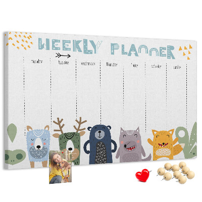 Tablero de corcho decorado planificador semanal con diseño de animales coloridos