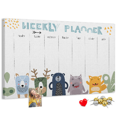 Tablero de corcho decorado planificador semanal con diseño de animales coloridos