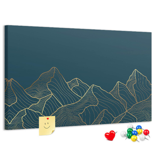 Tablero de corcho decorado con diseño de montañas en tonos dorados sobre fondo oscuro