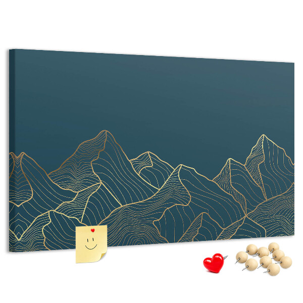 Tablero de corcho decorado con diseño de montañas en tonos dorados sobre fondo oscuro