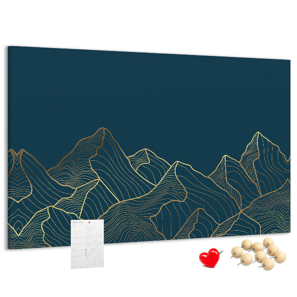 Tablero de corcho decorado con diseño de montañas en tonos dorados sobre fondo oscuro
