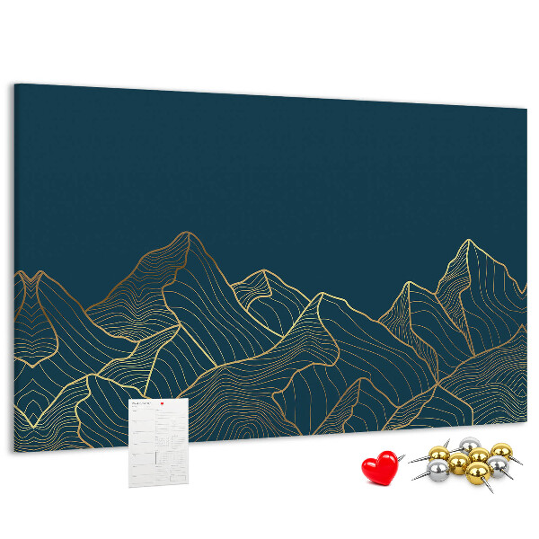 Tablero de corcho decorado con diseño de montañas en tonos dorados sobre fondo oscuro