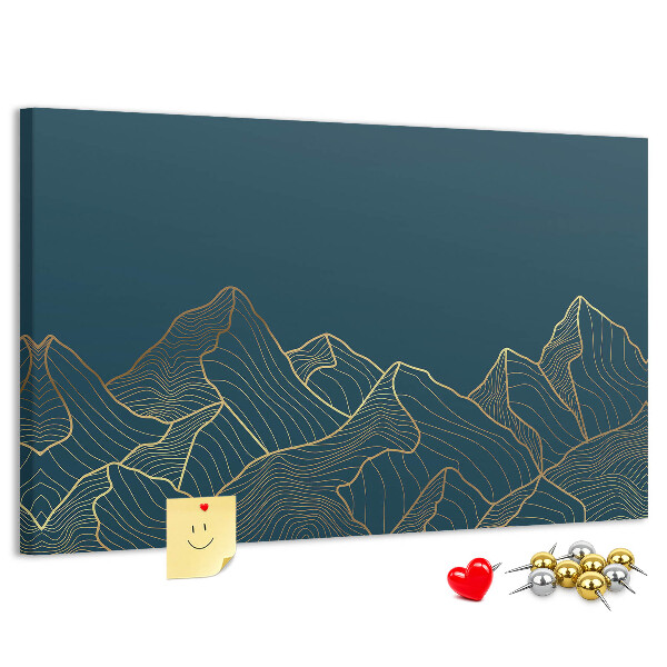 Tablero de corcho decorado con diseño de montañas en tonos dorados sobre fondo oscuro