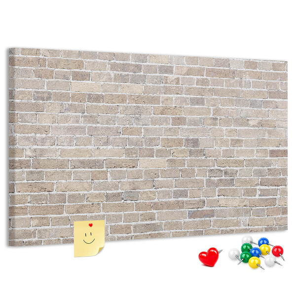 Tablero de corcho decorado con diseño de pared de ladrillo en tonos neutros