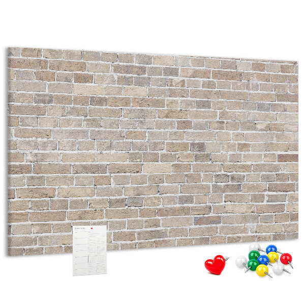 Tablero de corcho decorado con diseño de pared de ladrillo en tonos neutros