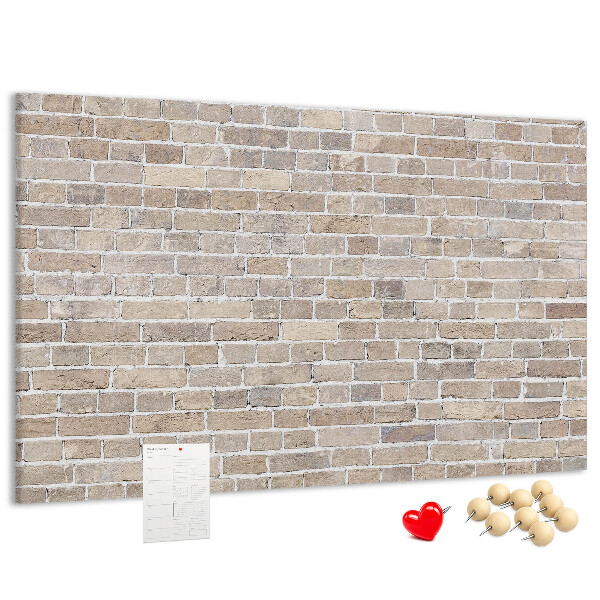 Tablero de corcho decorado con diseño de pared de ladrillo en tonos neutros