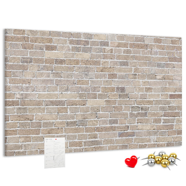 Tablero de corcho decorado con diseño de pared de ladrillo en tonos neutros