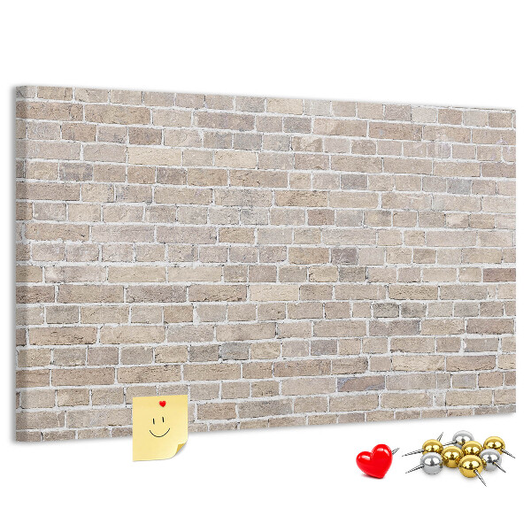 Tablero de corcho decorado con diseño de pared de ladrillo en tonos neutros
