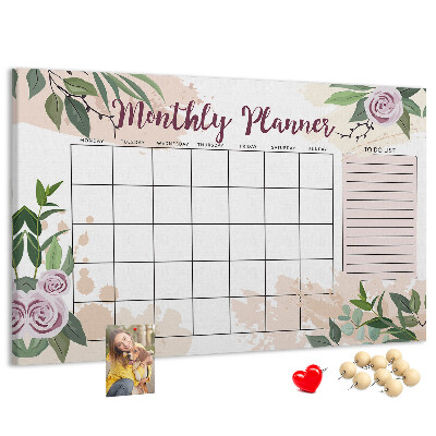 Calendario mensual con detalles florales y tablero de anuncios