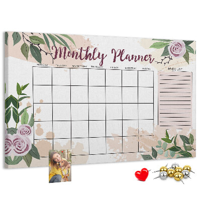 Calendario mensual con detalles florales y tablero de anuncios