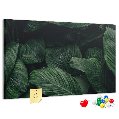 Tablero de anuncios con diseño de hojas verdes en un denso entramado