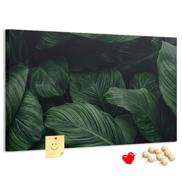 Tablero de anuncios con diseño de hojas verdes en un denso entramado