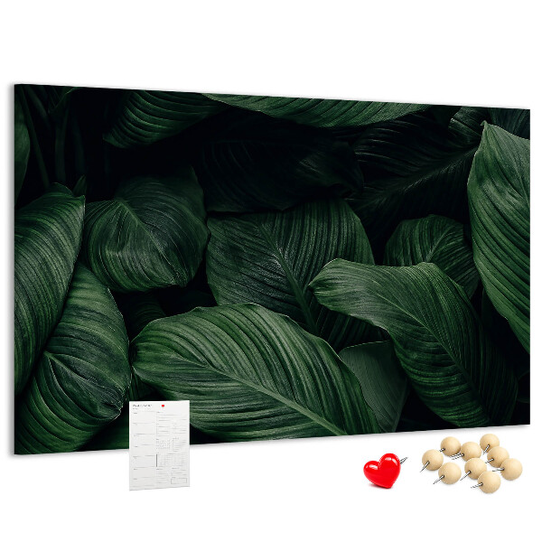 Tablero de anuncios con diseño de hojas verdes en un denso entramado