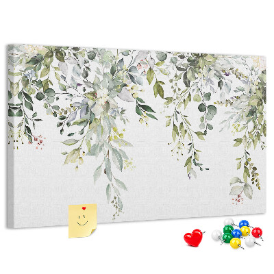 Tablero de anuncios con diseño de hojas verdes y flores delicadas al fondo