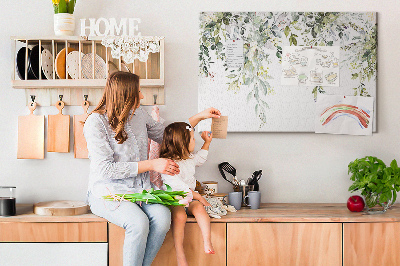 Tablero de anuncios con diseño de hojas verdes y flores delicadas al fondo