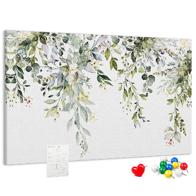 Tablero de anuncios con diseño de hojas verdes y flores delicadas al fondo