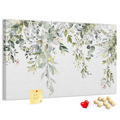 Tablero de anuncios con diseño de hojas verdes y flores delicadas al fondo