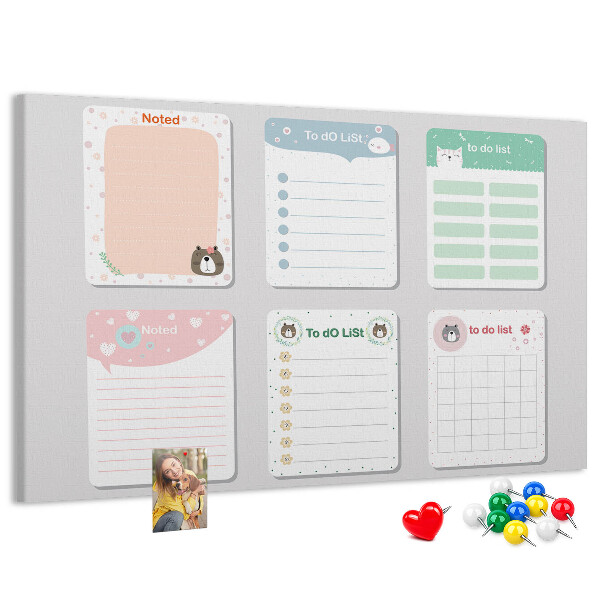 Pizarra de corcho con diseño de cuadernos coloridos con motivos de animales