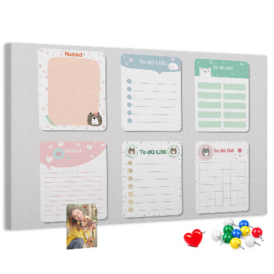 Pizarra de corcho con diseño de cuadernos coloridos con motivos de animales