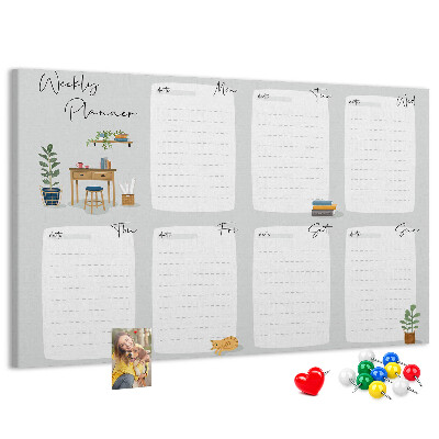 Pizarra de corcho con diseño de agenda semanal y detalles de plantas