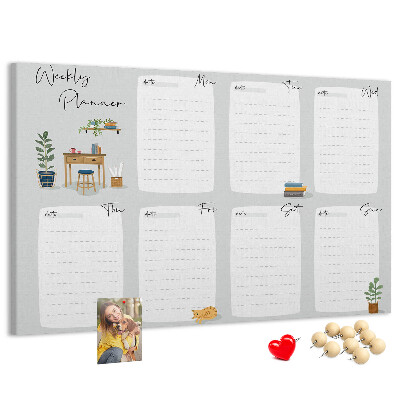 Pizarra de corcho con diseño de agenda semanal y detalles de plantas
