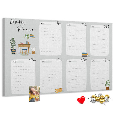 Pizarra de corcho con diseño de agenda semanal y detalles de plantas