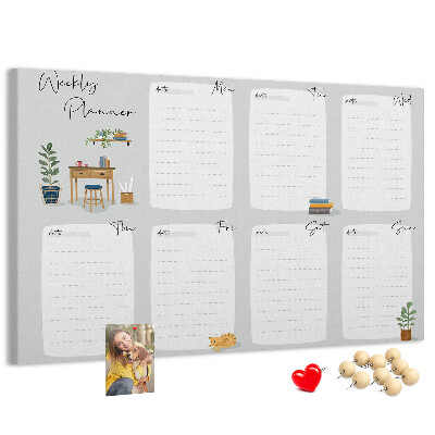 Pizarra de corcho con diseño de agenda semanal y detalles de plantas