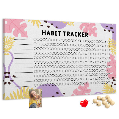 Tablero de corcho decorado con diseño tropical de hojas y puntos