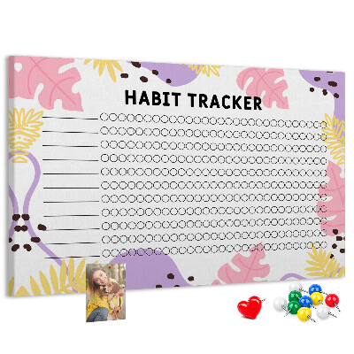 Tablero de corcho decorado con diseño tropical de hojas y puntos