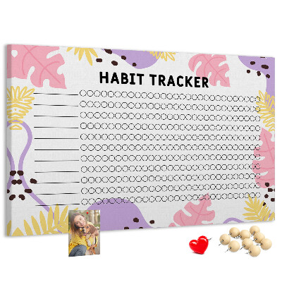 Tablero de corcho decorado con diseño tropical de hojas y puntos