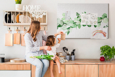 Pizarra de corcho con diseño de hojas verdes sobre fondo claro