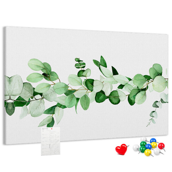 Pizarra de corcho con diseño de hojas verdes sobre fondo claro