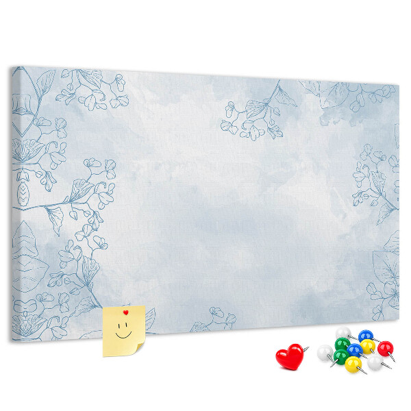 Tablero de corcho decorado con delicados detalles florales en el fondo