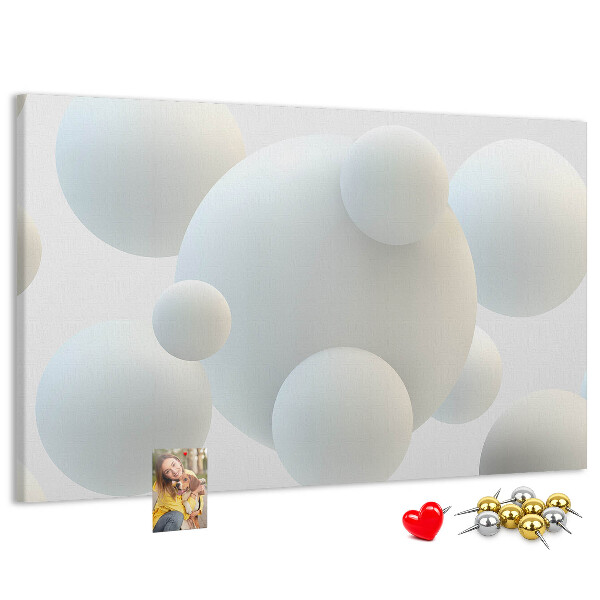 Tablero de anuncios bolas blancas sobre fondo claro