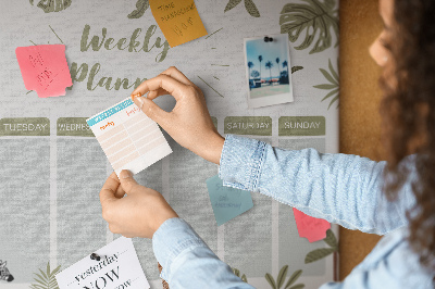 Pizarra de corcho con diseño de agenda semanal y estampado de plantas