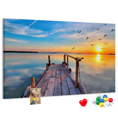 Tablero de anuncios Puesta de sol sobre un lago tranquilo