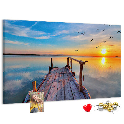 Tablero de anuncios Puesta de sol sobre un lago tranquilo