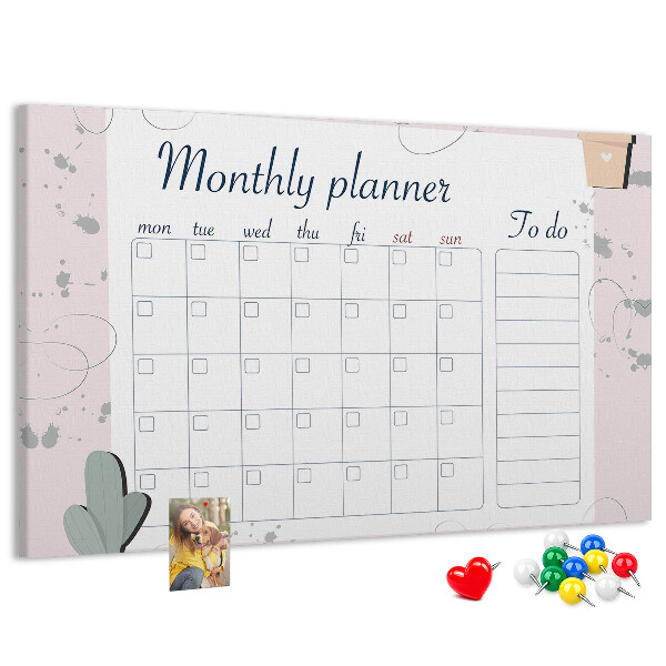 Pizarra de corcho con diseño de agenda mensual y motivos de plantas