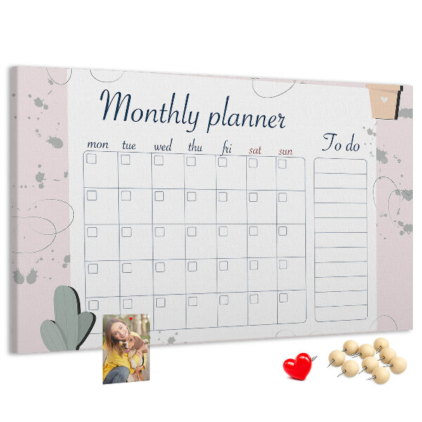 Pizarra de corcho con diseño de agenda mensual y motivos de plantas