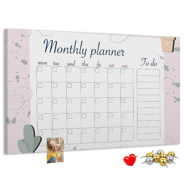 Pizarra de corcho con diseño de agenda mensual y motivos de plantas