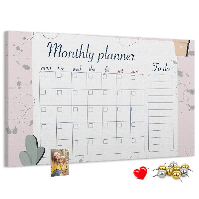 Pizarra de corcho con diseño de agenda mensual y motivos de plantas