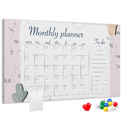 Pizarra de corcho con diseño de agenda mensual y motivos de plantas