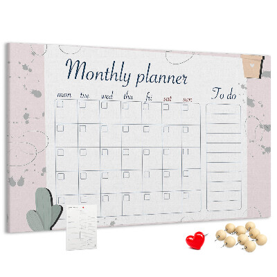 Pizarra de corcho con diseño de agenda mensual y motivos de plantas